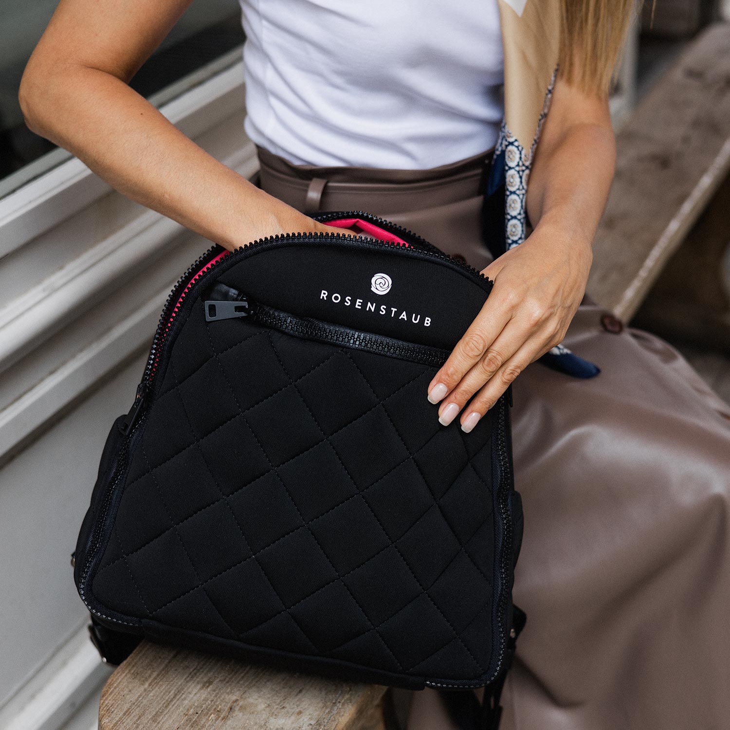 Closeup of Model showcasing the Yulex Black natural rubber Backpack by Rosenstaub, an eco-friendly premium brand from Germany